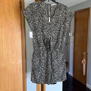 Reprise Cream spotted black Romper.  Like new condition.  Size Large